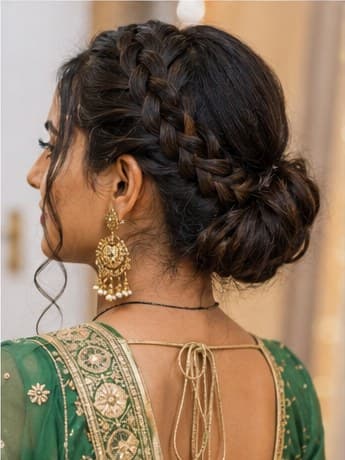 A crown braid gathered into a low bun
