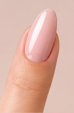Almond-shaped nail extension in a sheer pink finish