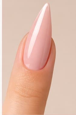 Stiletto-shaped nail extension in a sheer pink finish